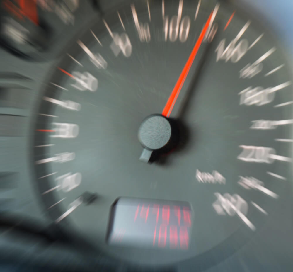 picture of a car odometer that is out of focus